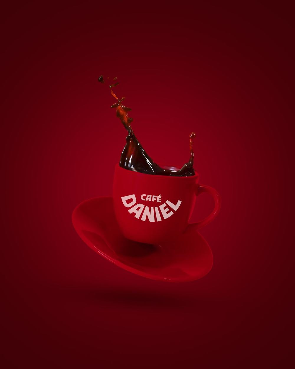 A red espresso cup suspended in mid-air with coffee frozen above it